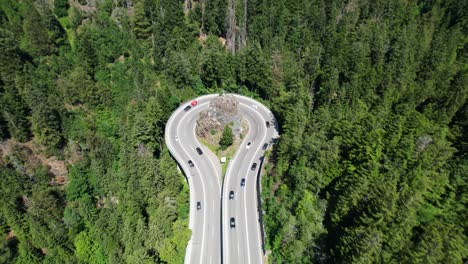 aerial view of traffic on an impressive curve in the mountains