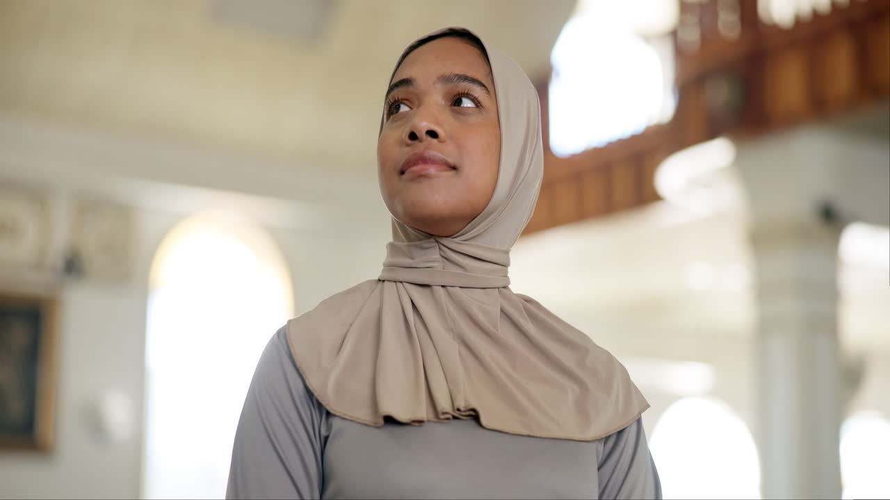 Portrait of a Muslim woman wearing a hijab in a mosque