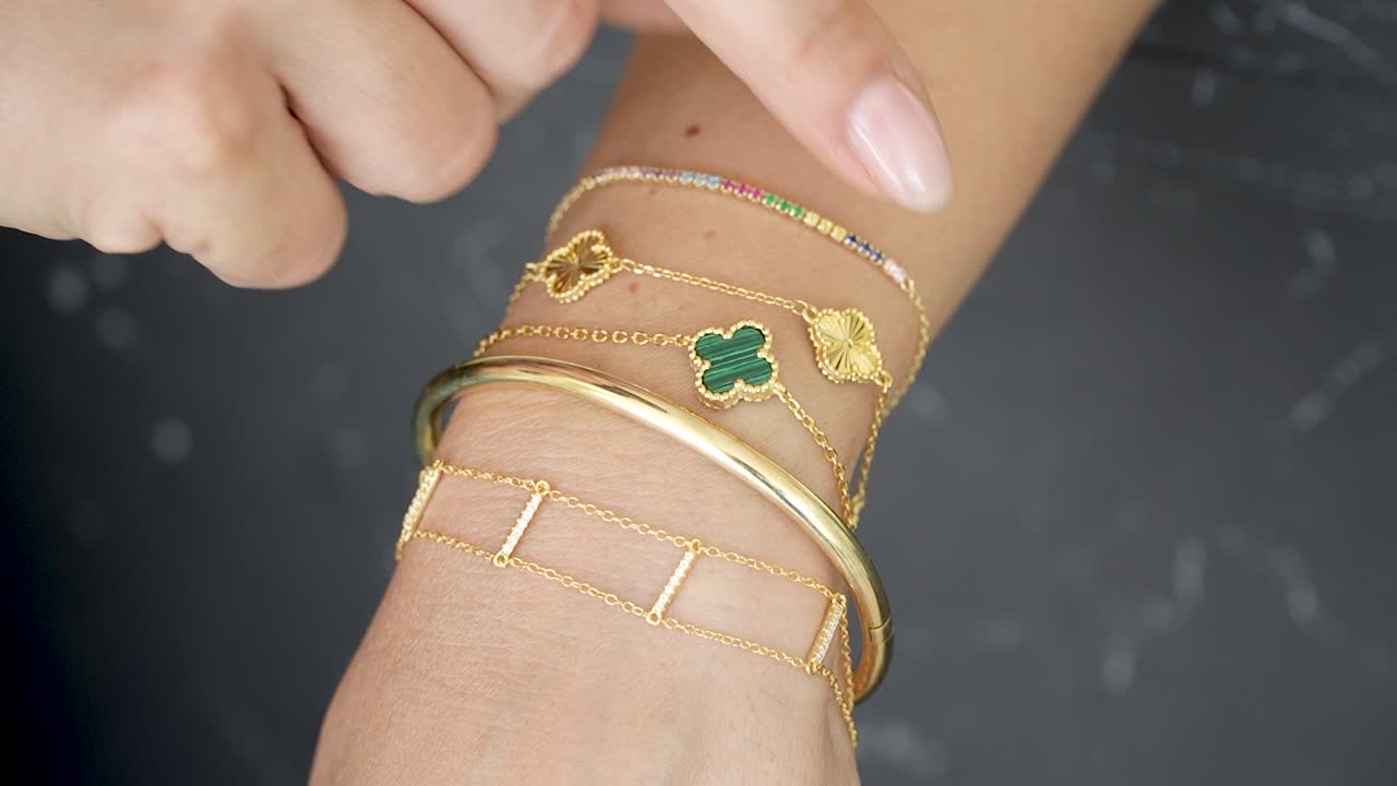 Stunning selection of handmade gold bracelets with intricate charms showcases elegance and charm. Ideal for elevating your style and making a statement