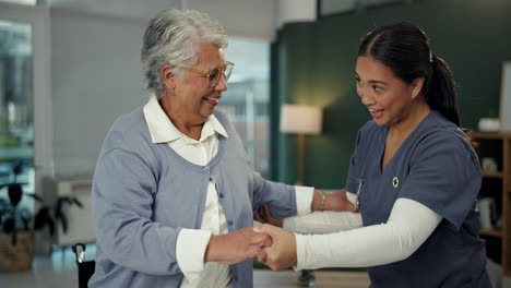 nurse assisting senior woman