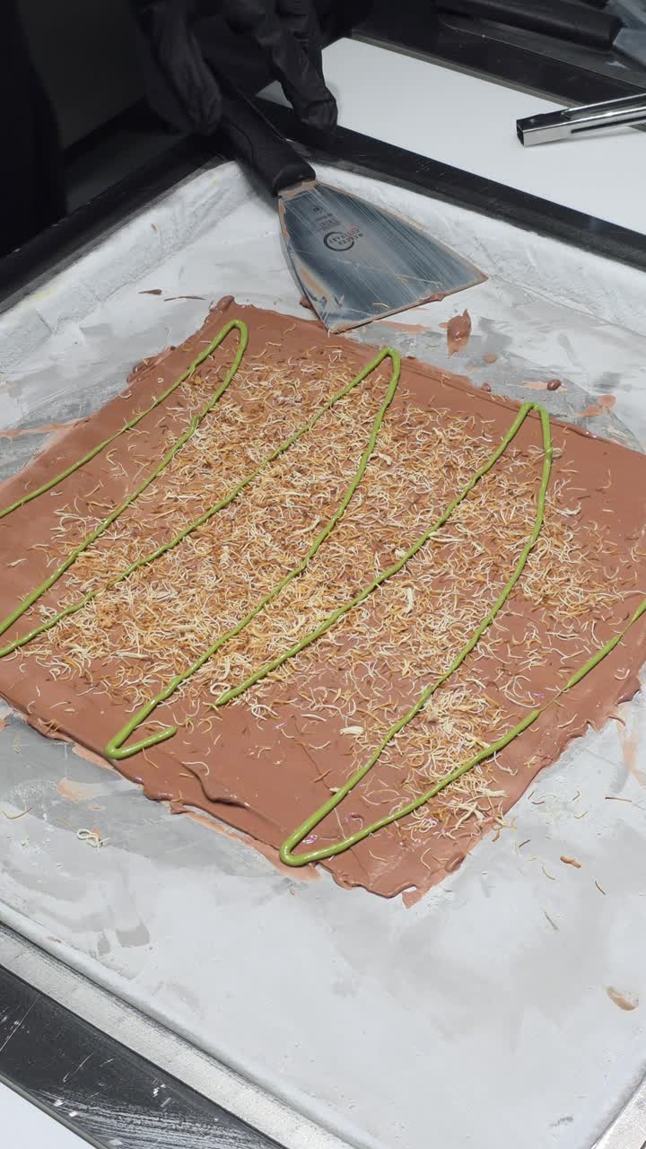 Dubai Chocolate Rolled ice cream is prepared live at an ice cream shop in Dubai