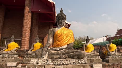 wind blowing the robe of a buddha statue