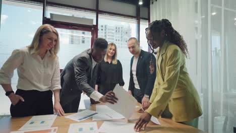 african and caucasian business people on business meeting in modern office top management