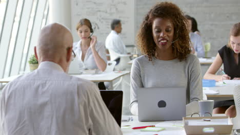 Businesswoman-In-Customer-Service-Department-Shot-On-R3D