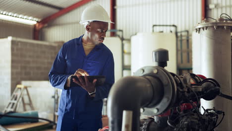 tablet, engineer and machinery with a black man