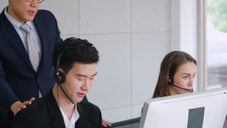 Business-people-wearing-headset-working-in-office