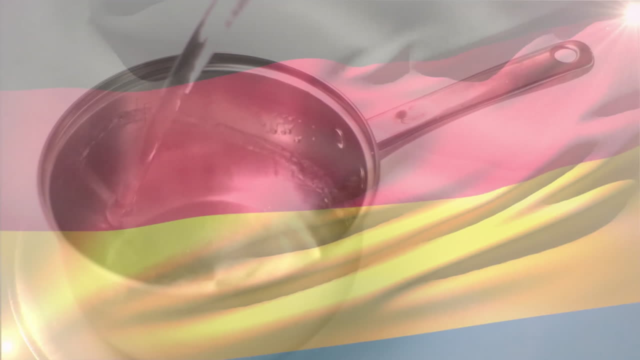 Pouring liquid into saucepan with German flag animation in background
