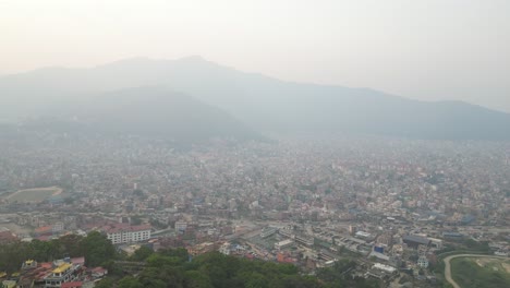 Drone-Shot-of-foothills-In-Kathmandu,-Nepal-at-the-base-of-the-Himalayas