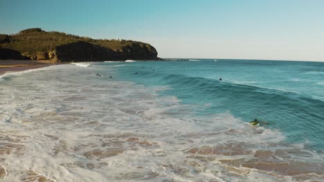 surfers enjoying the waves on a sunny day