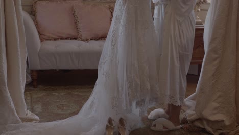 bride getting ready to try on wedding dress