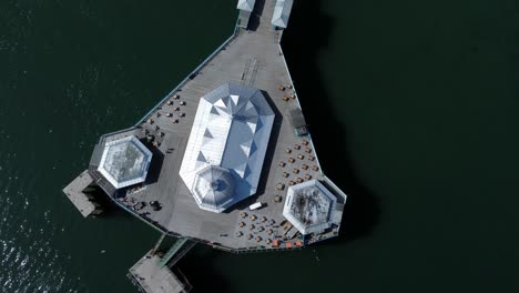 llandudno pier seaside resort landmark silver pavilion wooden boardwalk aerial top down view