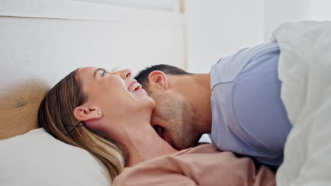 Laugh,-relax-and-couple-in-conversation-in-bed