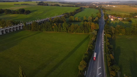 Aerial-view-of-a-multi-way-road-with-an-intersection-and-passing-cars