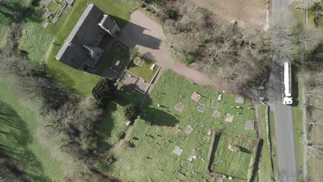 a bird's eye view of an old irish chapel and a graveyard