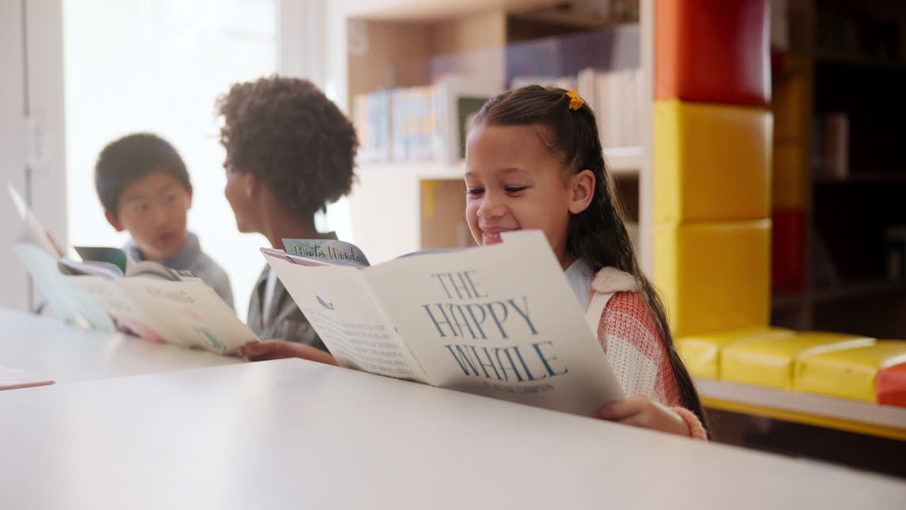 Children reading books in a library