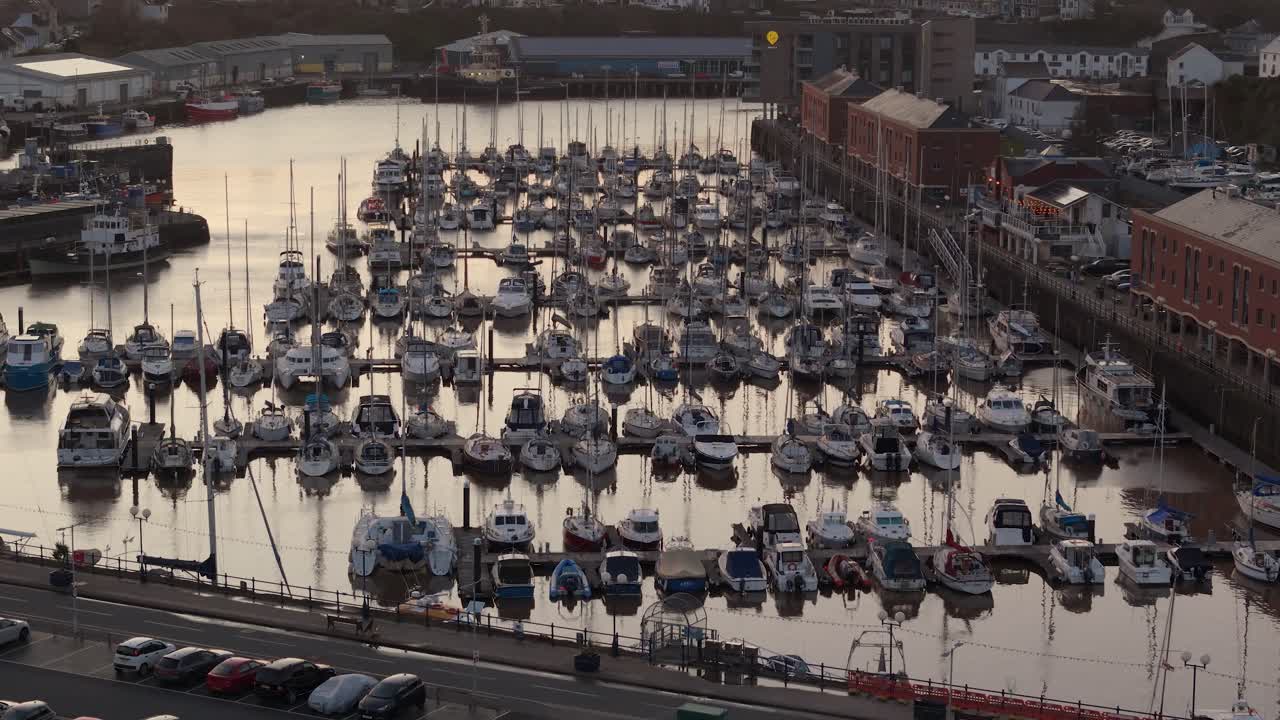 Crowded marina at Milford Waterfront, Pembrokeshire, boats docked in the water