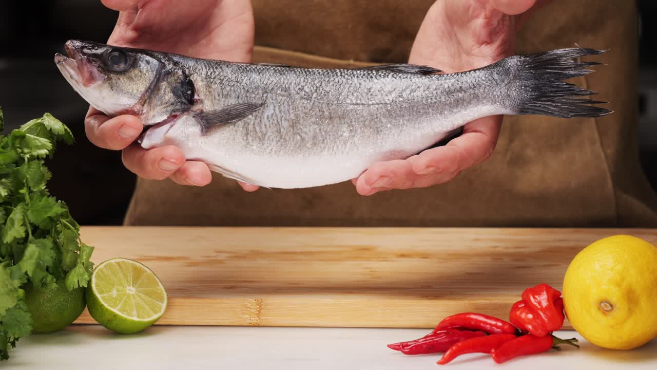 Chef preparing fresh sea bass