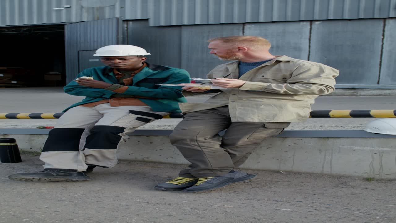 Workers Enjoying Lunch Break at Industrial Facility