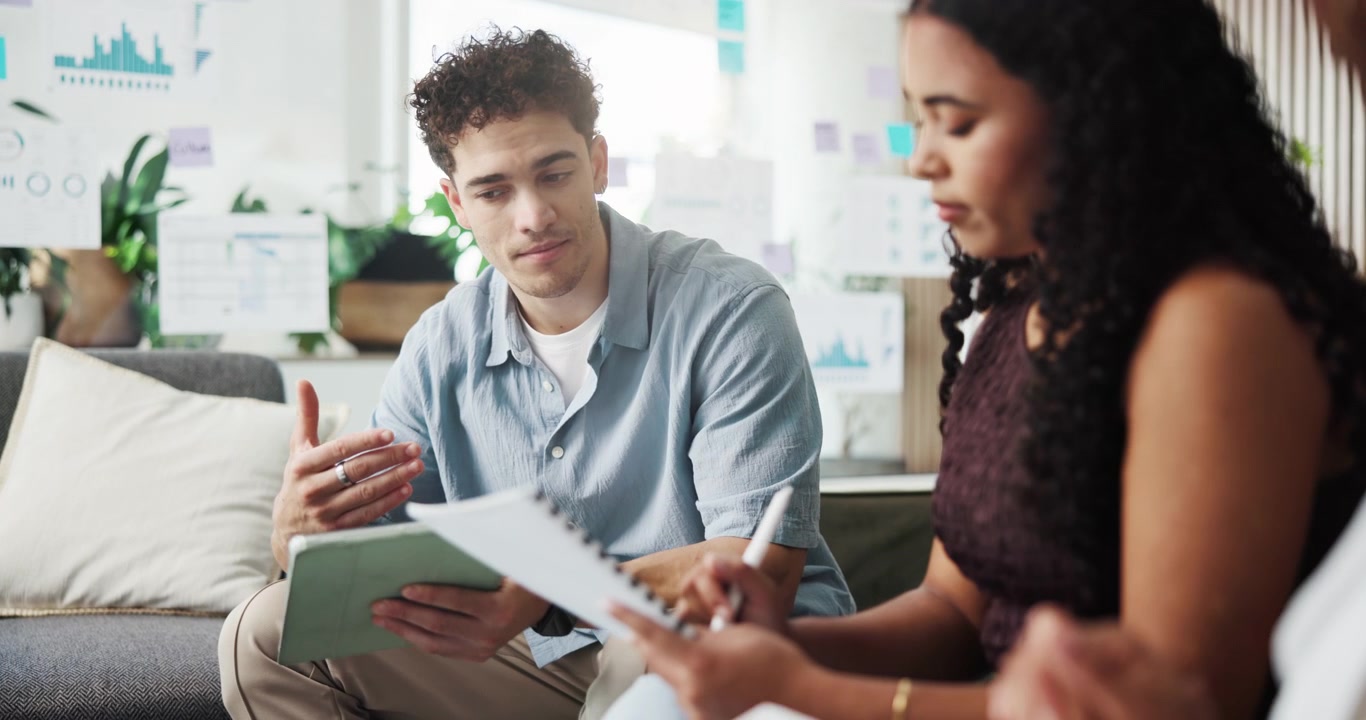 Young Professionals Collaborating on a Project in a Modern Office