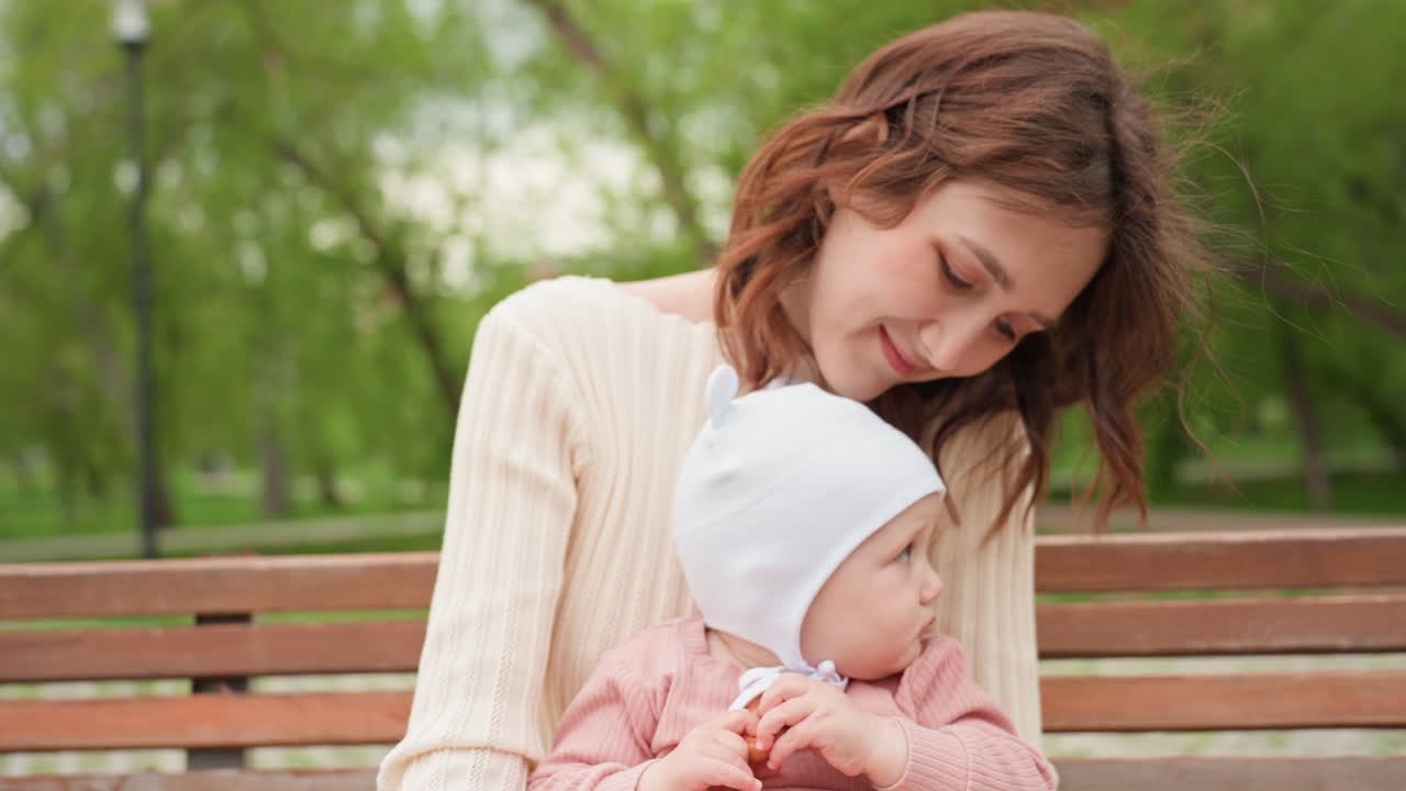 Peaceful Motherinfant Scene, Tranquil Scene Of Mother Softly Embracing Her Newborn Amid Nature, Calm Family Connection Captured As Mother Tenderly Holds Her Baby Surrounded By Lush Greenery