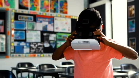 schoolboy using virtual reality headset in classroom 4k