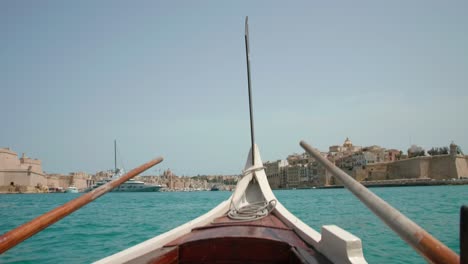 pov of a gondola going from valletta to the three cities in malta on a sunny summer day