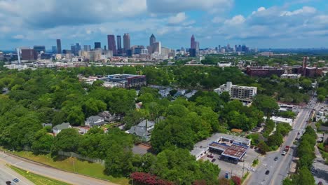 atlanta city skyline of atlanta with skyscrapers. cars on street in idyllic suburbia of usa. aerial wide shot. georgia, united states