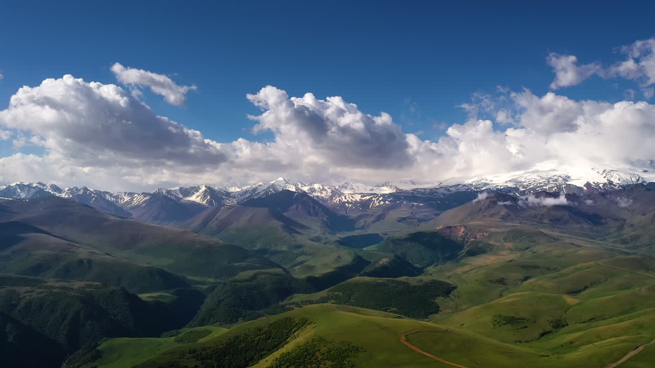 Elbrus Region. Flying over a highland plateau. Beautiful landscape of nature. Mount Elbrus is visible in the background.