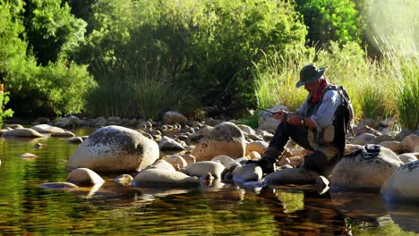 Man-fly-fishing-in-river