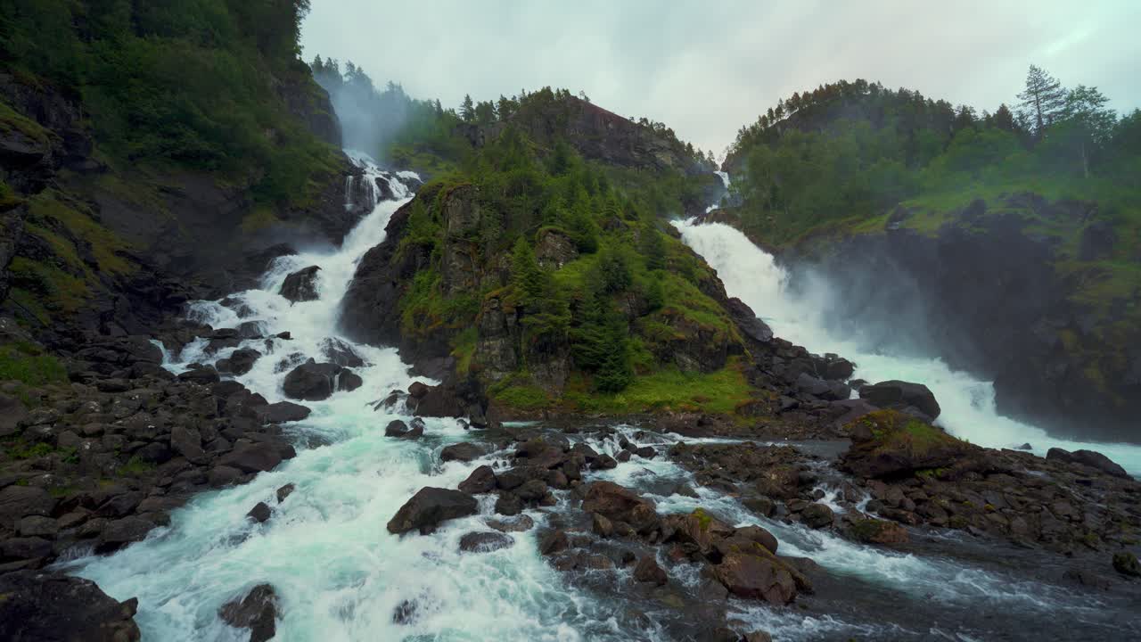 Latefossen twin waterfall, Norway. Idyllic cascade in scenic Scandinavia nature, lush green landscape.