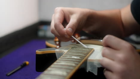 cleaning a guitar fretboard