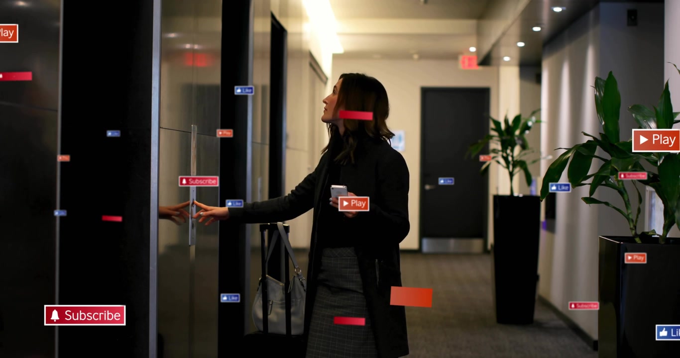 Woman walking hall pulling bag, checking phone for alerts and sparking overlay social media labels
