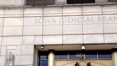 Iowa-Supreme-Court-building-sign-in-Des-Moines,-Iowa-with-gimbal-video-panning-left-to-right-close-up