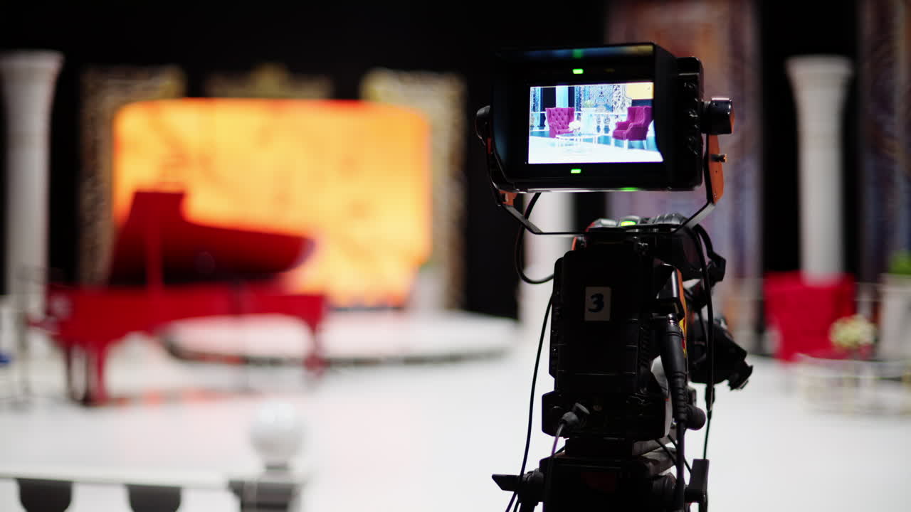 Professional camera filming with on the backstage of a TV set