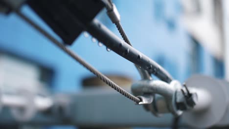 close-up of a metal cable hook and pulley system