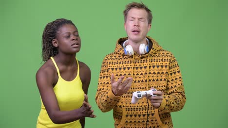 young multi-ethnic couple playing games together