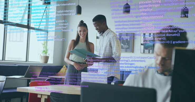 Code overlay appearing guiding man pointing documents and teen girl flipping pages in tech office