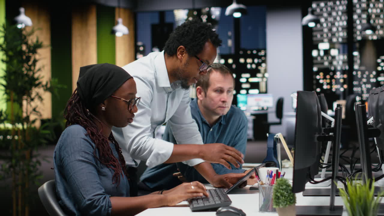 Diverse Business Team Collaborating on Project in Modern Office