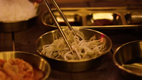 sequential serving of mung bean sprouts with chopsticks