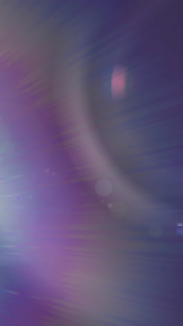 animation of spotlight with lens flare over dark background