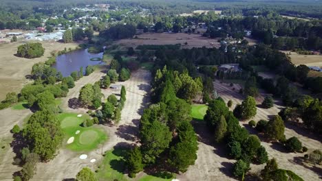 aerial view over the the trentham golf course with the township in the background, victoria, australia