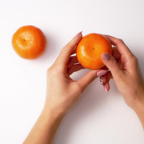 hands holding mandarin
