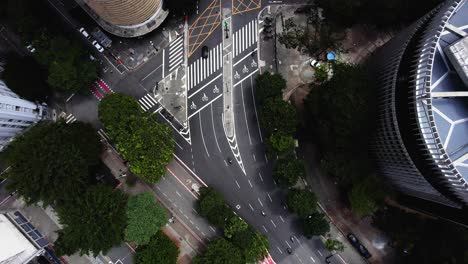 Aerial-view-following-motorbikes-on-Ipiranga-avenue-in-Sao-Paulo,-Brazil---Top-down,-drone-shot