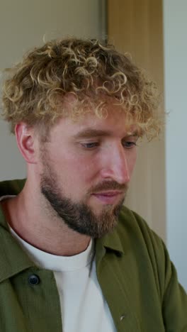 man with curly hair and beard