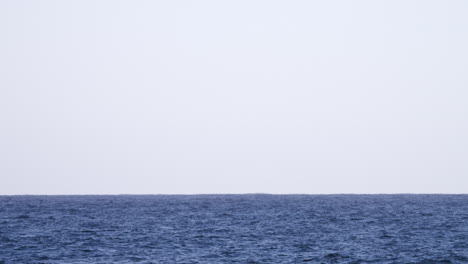 calm ocean with grey sky