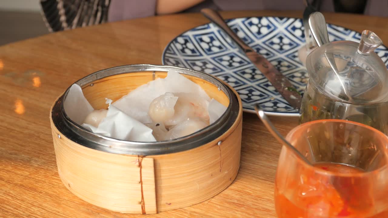 Eating Steamed Shrimp Dumplings