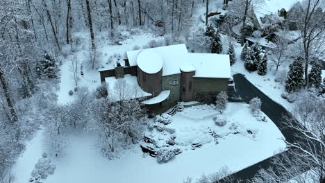 modern architecture home covered in winter snow