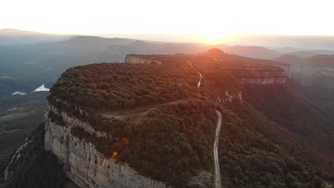 Aerial:-sunset-in-the-mountains,-gold-hour