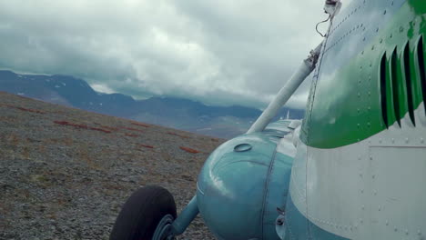 vintage airplane on a mountainous landscape