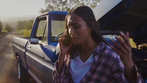 Young-woman-on-a-road-trip-in-pick-up-truck